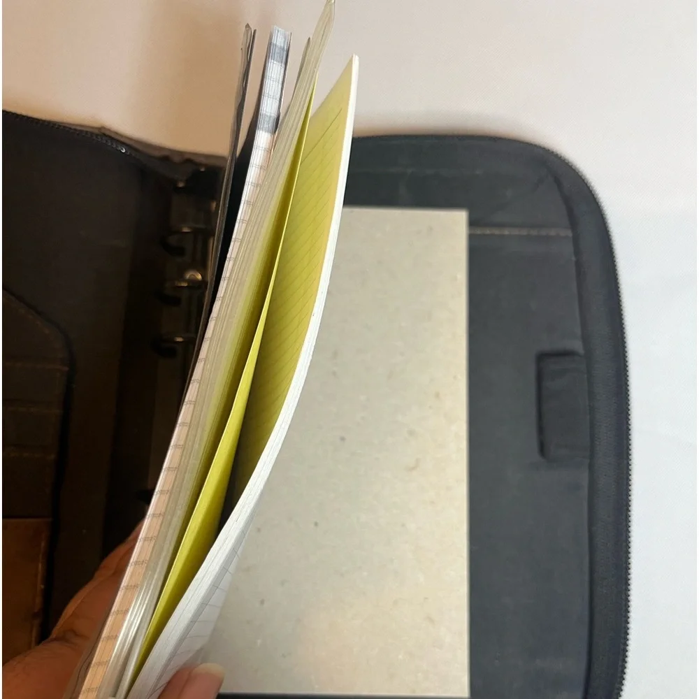 Day Timer Brown Folder With Some Papers